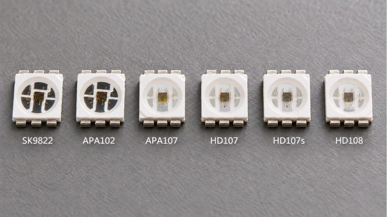 Six labeled addressable RGB LED packages with six terminals each, arranged for comparison.