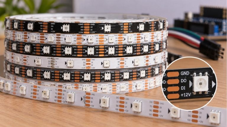 Several addressable LED tape types stacked together with a close-up package detail.