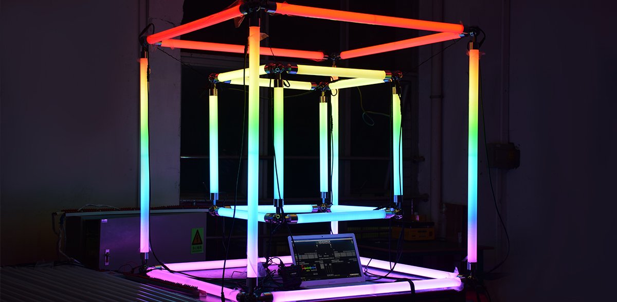 Addressable LED pixel tubes forming a colour-changing cube installation