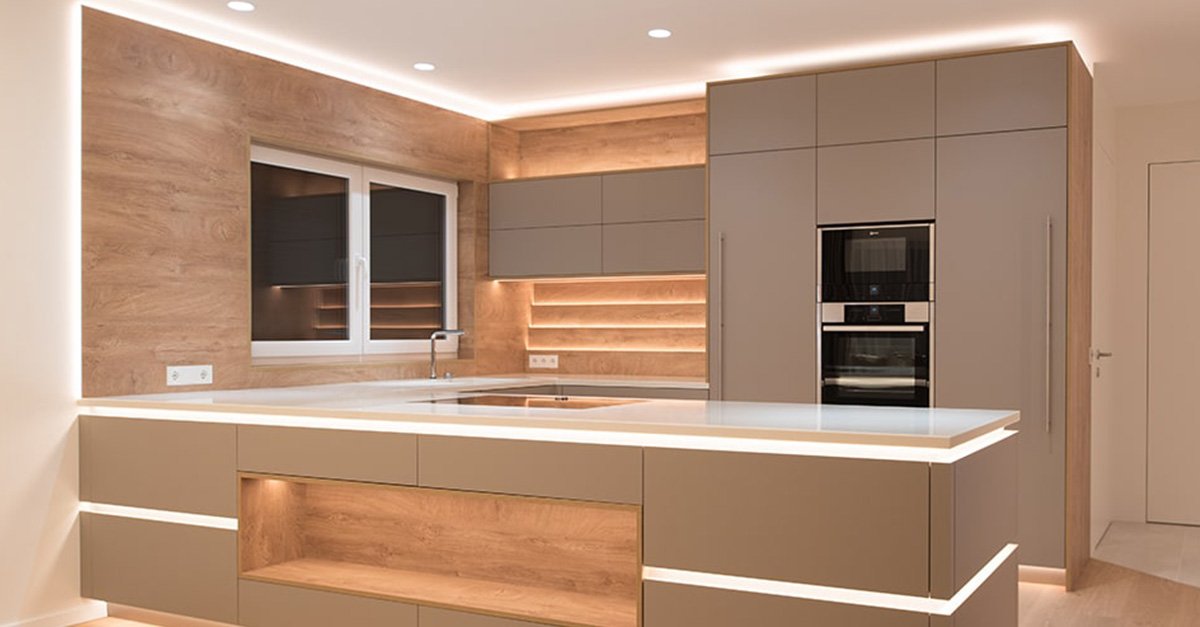 Warm white COB LED strip under kitchen cabinets and along the island toe-kick