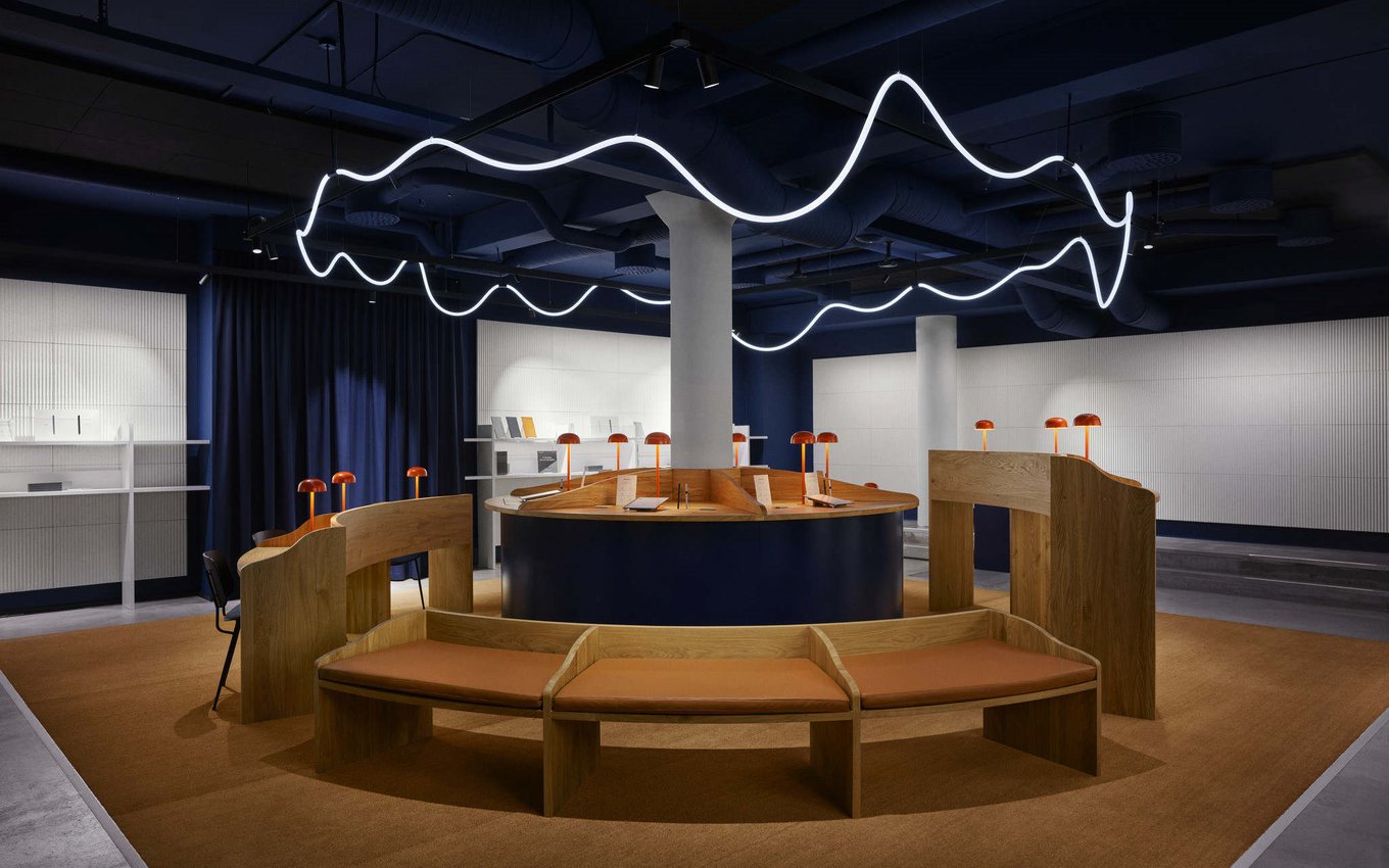 Curved white LED neon flex on the ceiling of a showroom