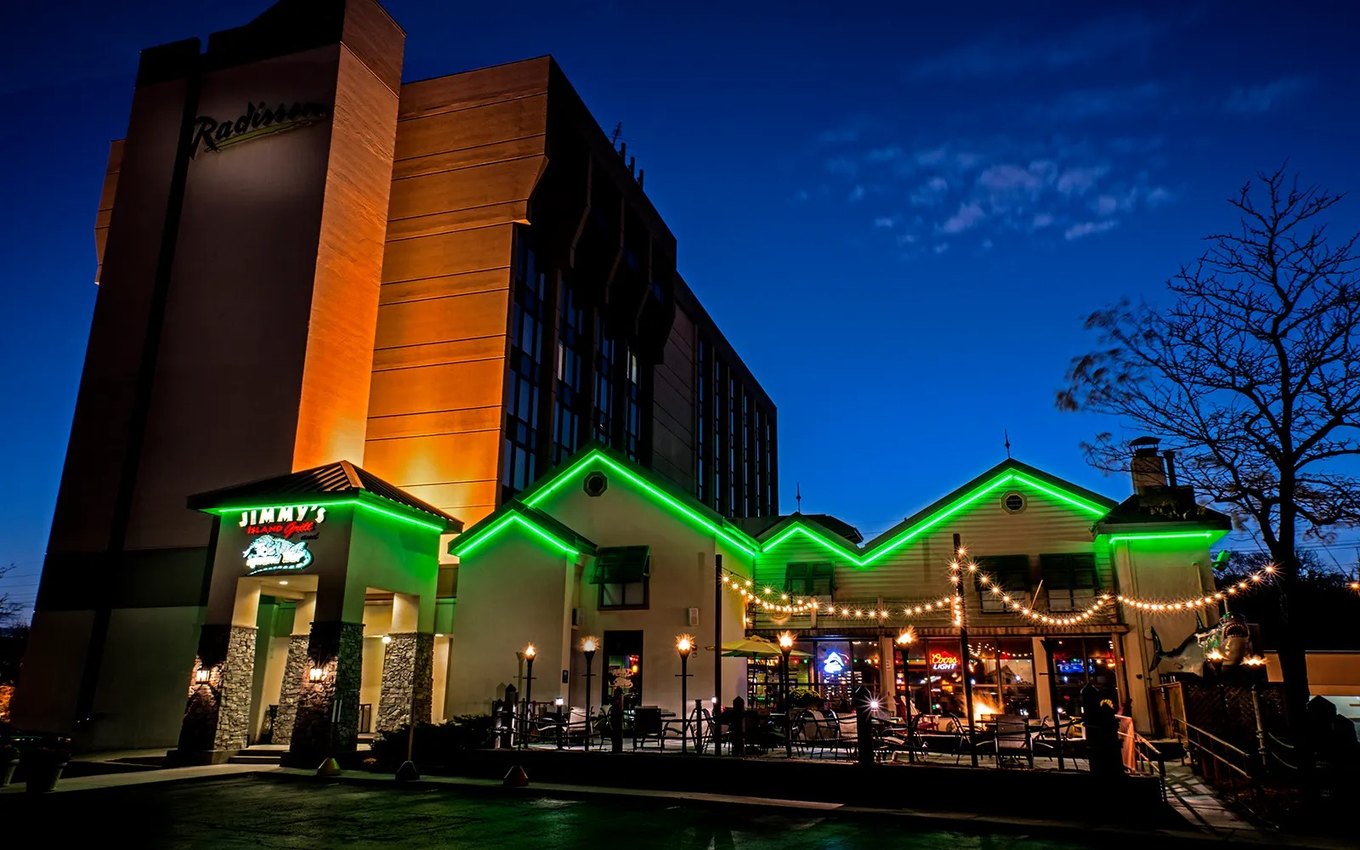 Green LED neon flex along a hotel roofline