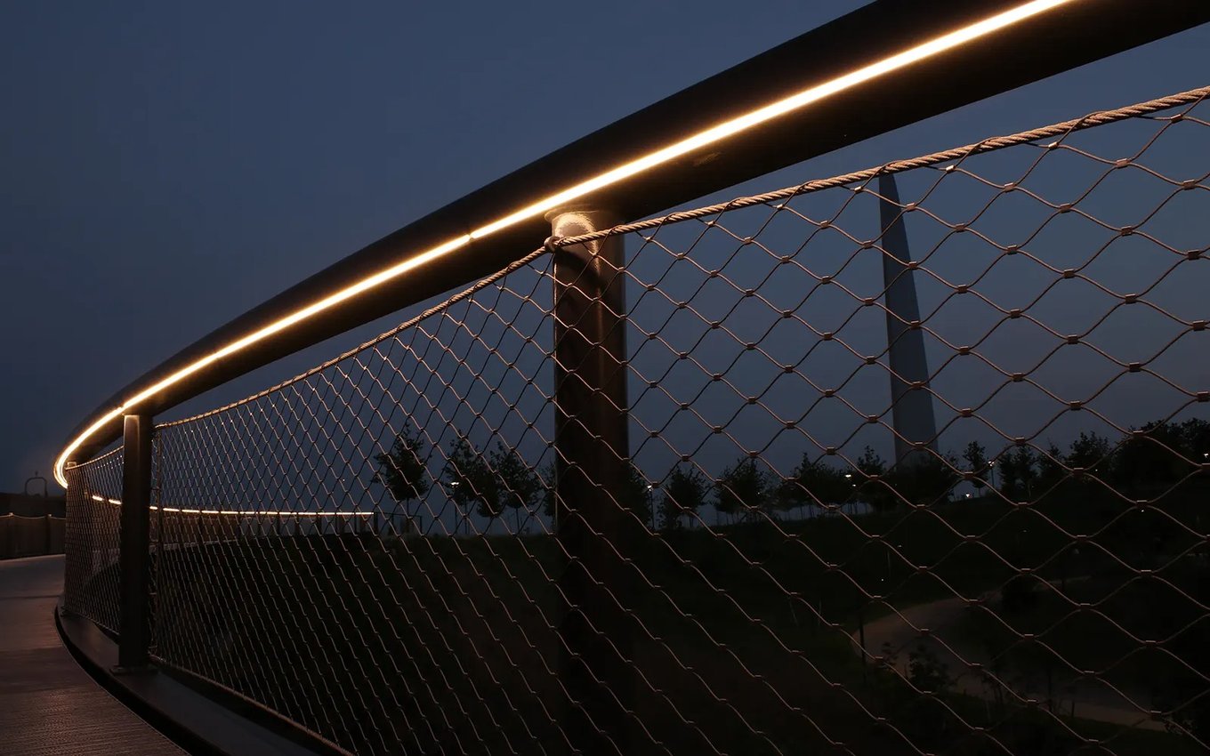 LED neon flex mounted under an outdoor railing handrail