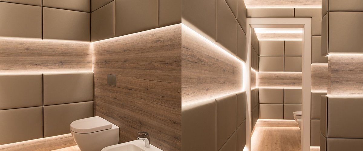 Recessed LED strip lines in wooden bathroom wall panels