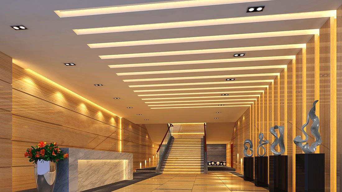 Hotel corridor with LED strip between ceiling slats