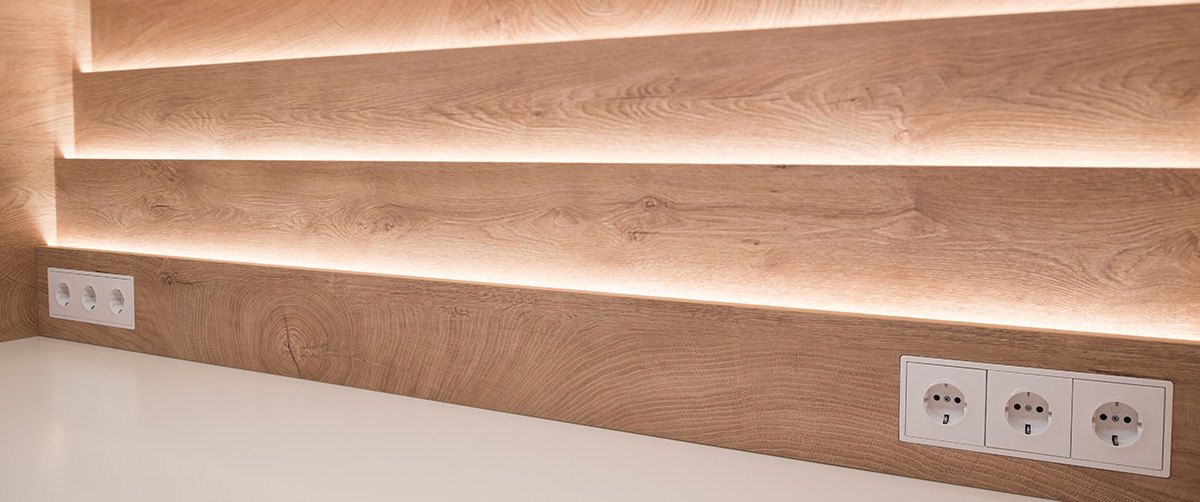 Close-up of an LED strip under a stair tread