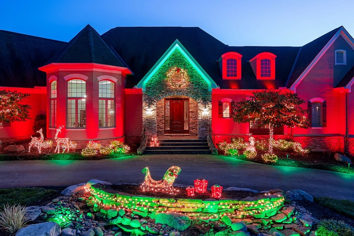 House decorated with red and green LED lighting for Christmas