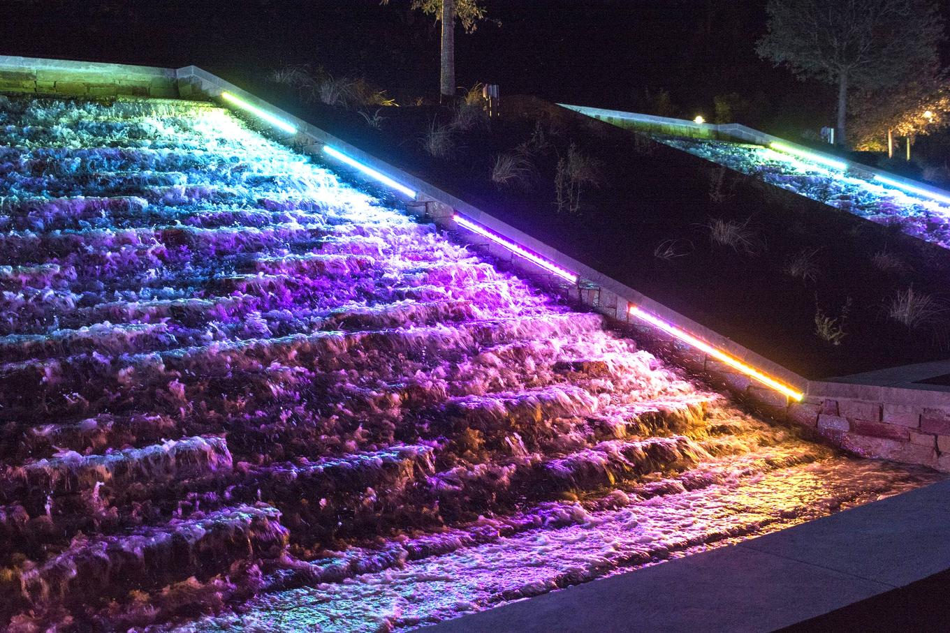 RGB LED strip lighting a planted garden slope at night