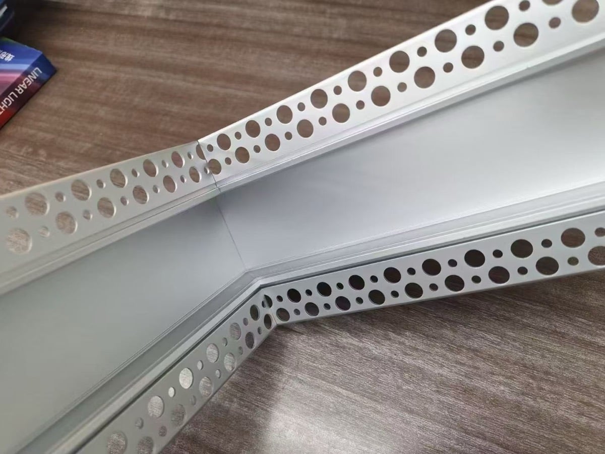 Custom angle cut plaster-in LED aluminium profile with the diffuser cut to match, forming an obtuse bend