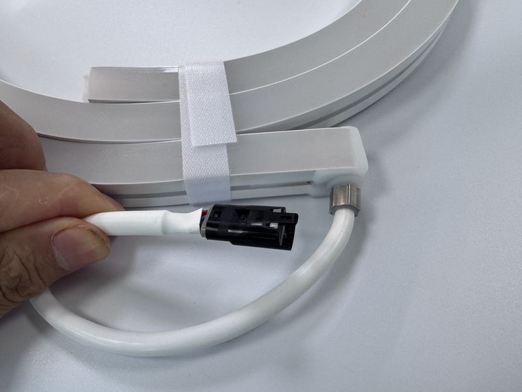 Connector lead soldered to LED neon flex with the cut end sealed by an end cap