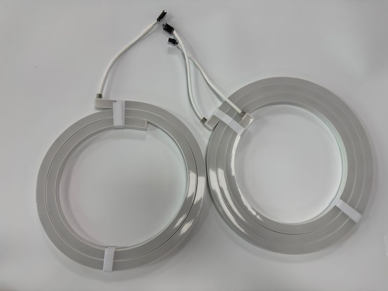 Two finished LED neon flex coils with connector leads fitted