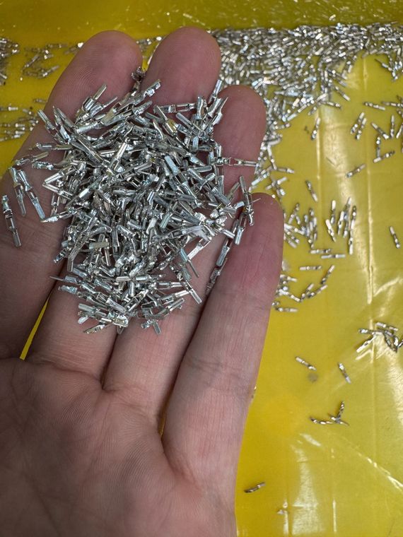 Loose crimp terminals cut from the reel, ready to crimp onto LED strip light wire