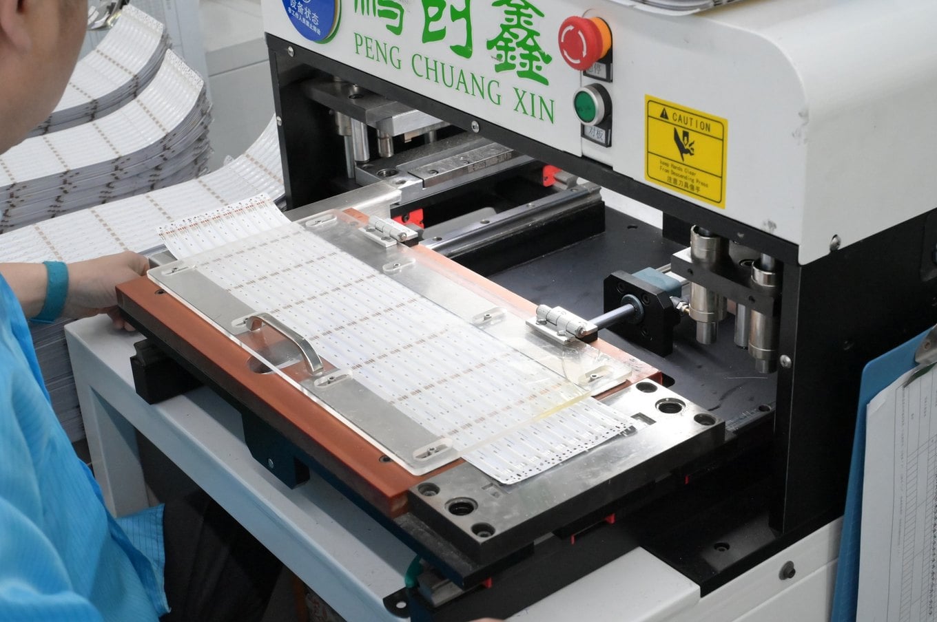 Punching machine separating LED strips from the panel