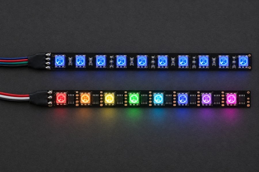 Plain RGB LED strip lit one colour next to an addressable LED strip with a different colour on every LED