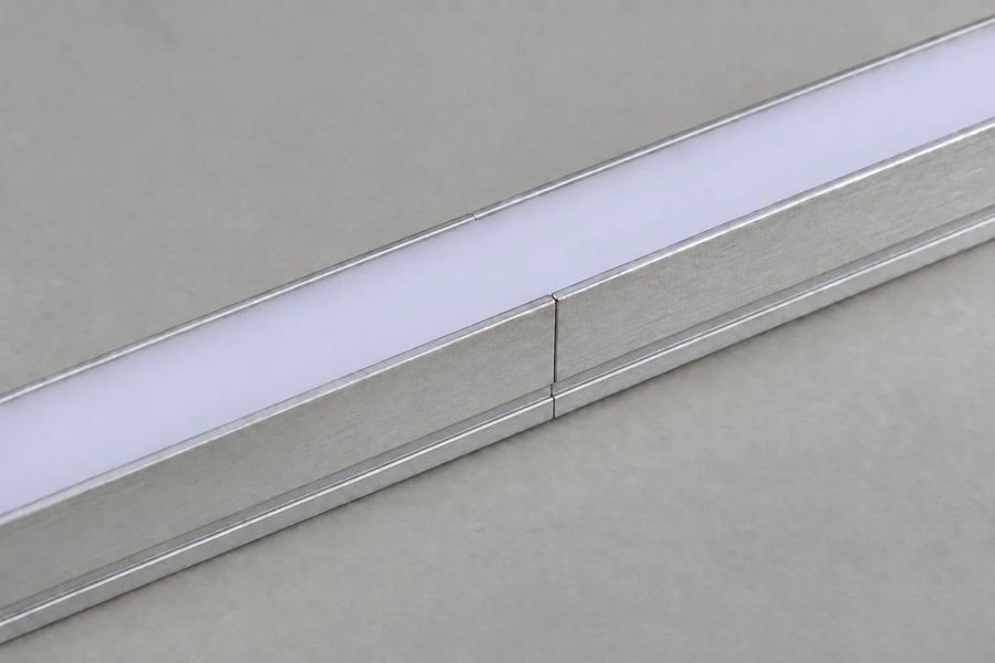 Two LED aluminium channel lengths joined with a splice connector under one continuous diffuser