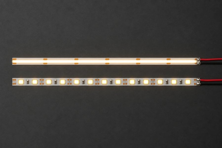 COB LED strip with a continuous line of light next to an SMD LED strip with visible LED dots